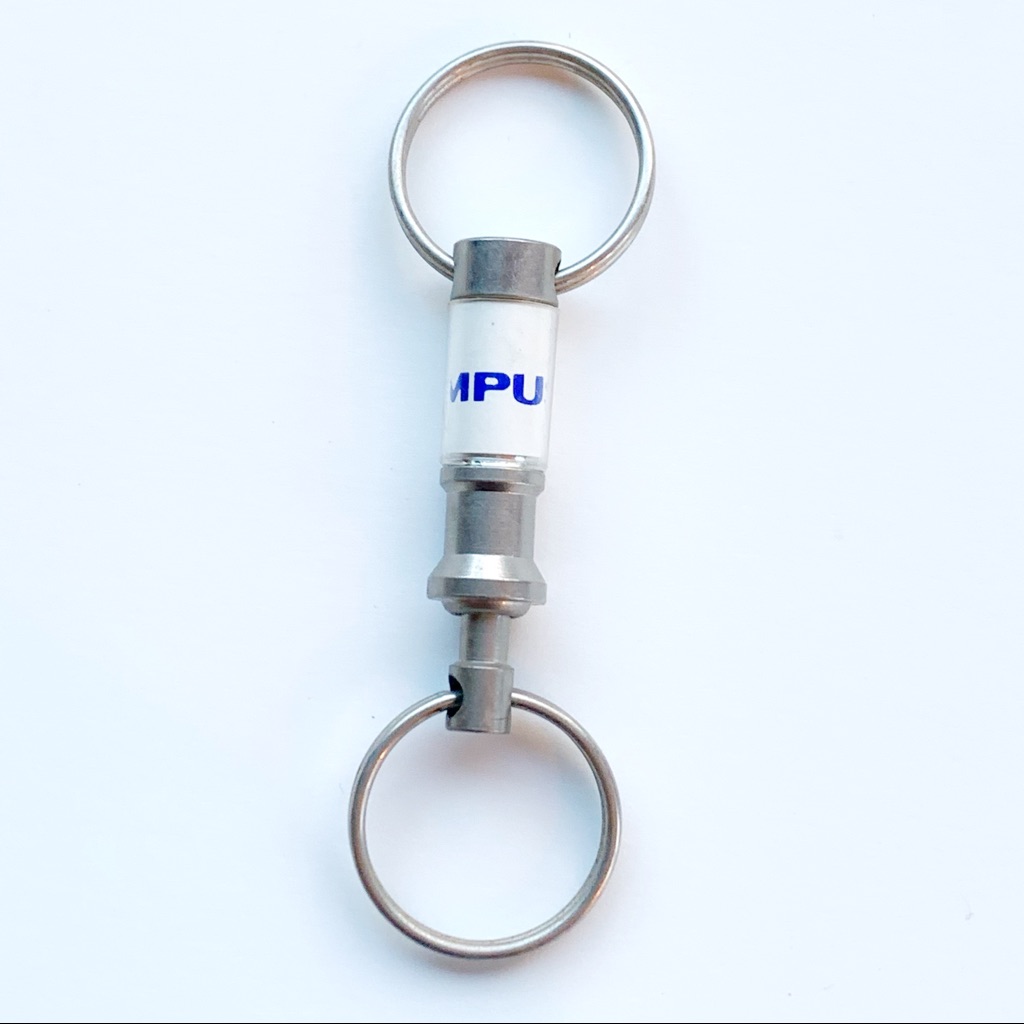 Olympus Auto Parts Vintage Keychain